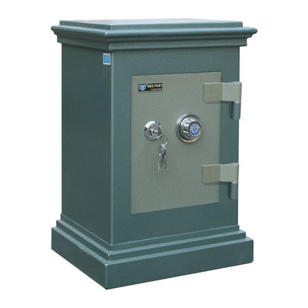 Két sắt an toàn màu xanh nhạt khóa mã số và chìa hiện đại trong phòng làm việc