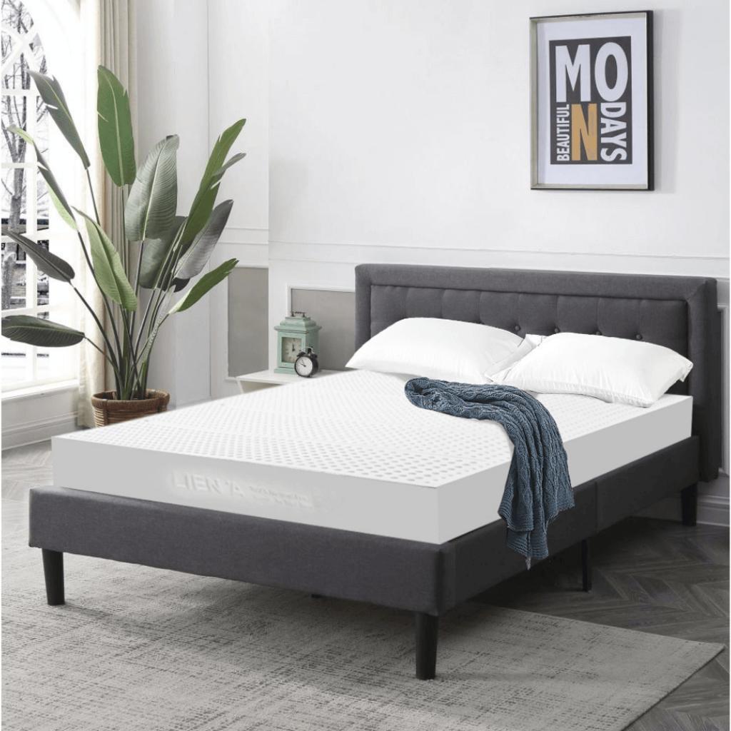 Hero image: Nệm Liên Á 5Zone trong phòng ngủ hiện đại — thấy rõ vải dệt kim và độ dày 10/15cm.