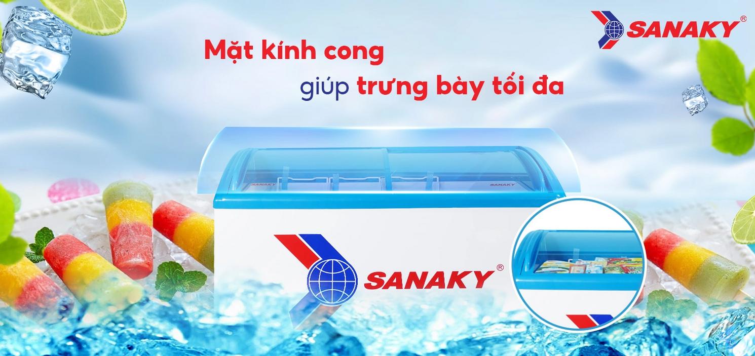 Mặt kính cong 2 cánh lùa thu hút khách và giảm thất thoát hơi lạnh (ảnh trưng bày).','imagePrompt':'Wide shot of the curved sliding glass top with products visible and LED lighting highlighting colors.