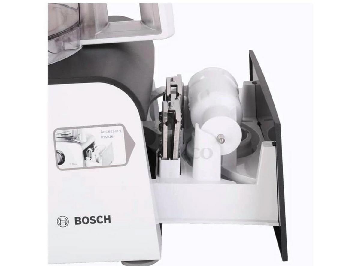 Close-up lưỡi dao thép không gỉ và cối nhựa kháng vỡ, minh họa sự bền bỉ và an toàn.