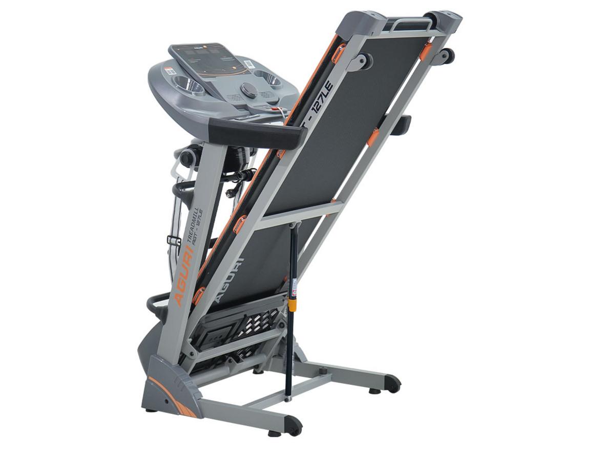 Thảm chạy 1.350 x 450 mm với lớp giảm chấn (ảnh minh họa) - imagePrompt: "Top-down view of treadmill belt showing texture and layers, highlight shock-absorption layers."